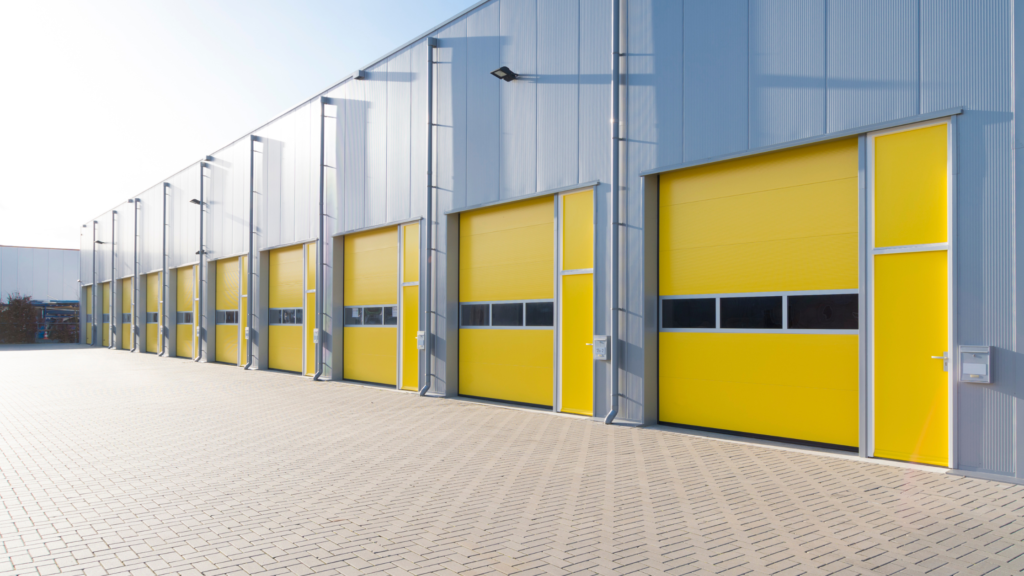 A commercial property with yellow bay doors.